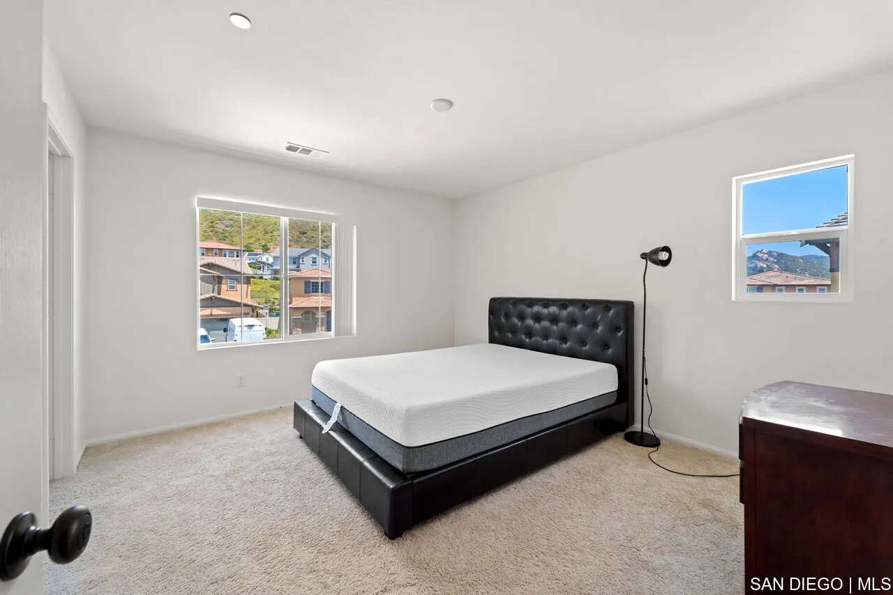 35858 Esperia Way Fallbrook, CA 92028 - Photo 29 of 37 a bed sitting in a bedroom next to a window