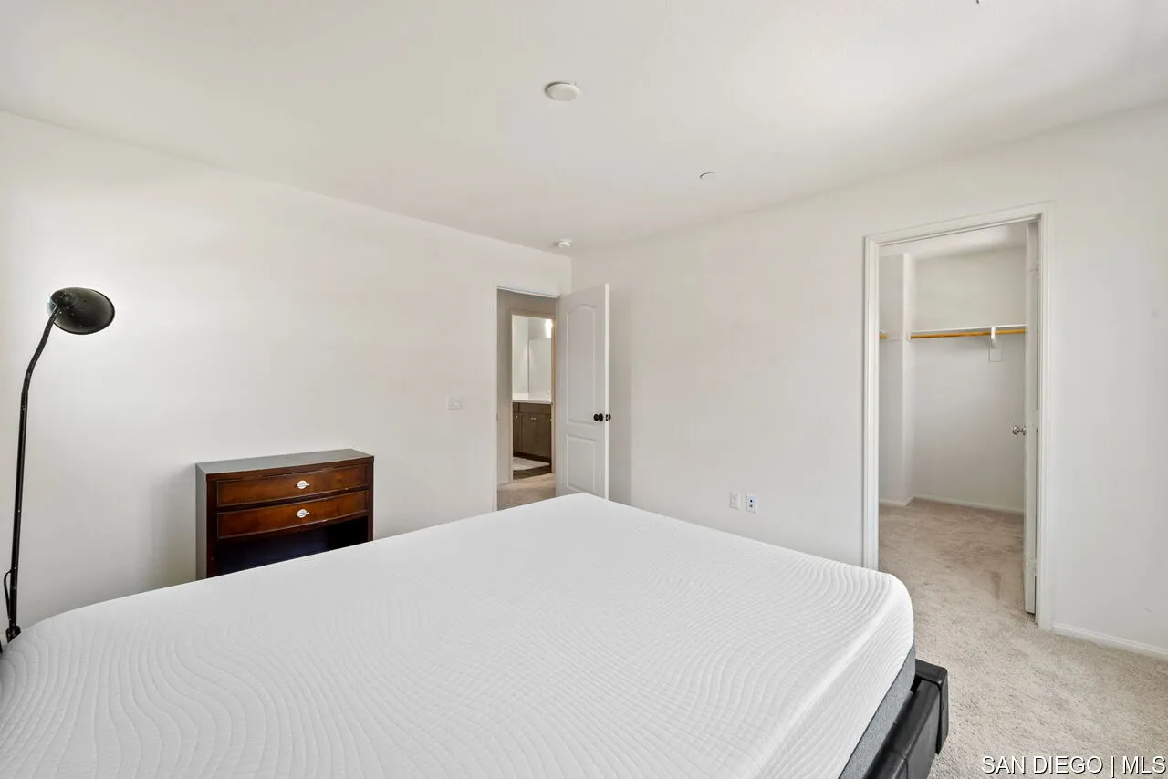 35858 Esperia Way Fallbrook, CA 92028 - Photo 30 of 37 a bedroom with a bed and a window