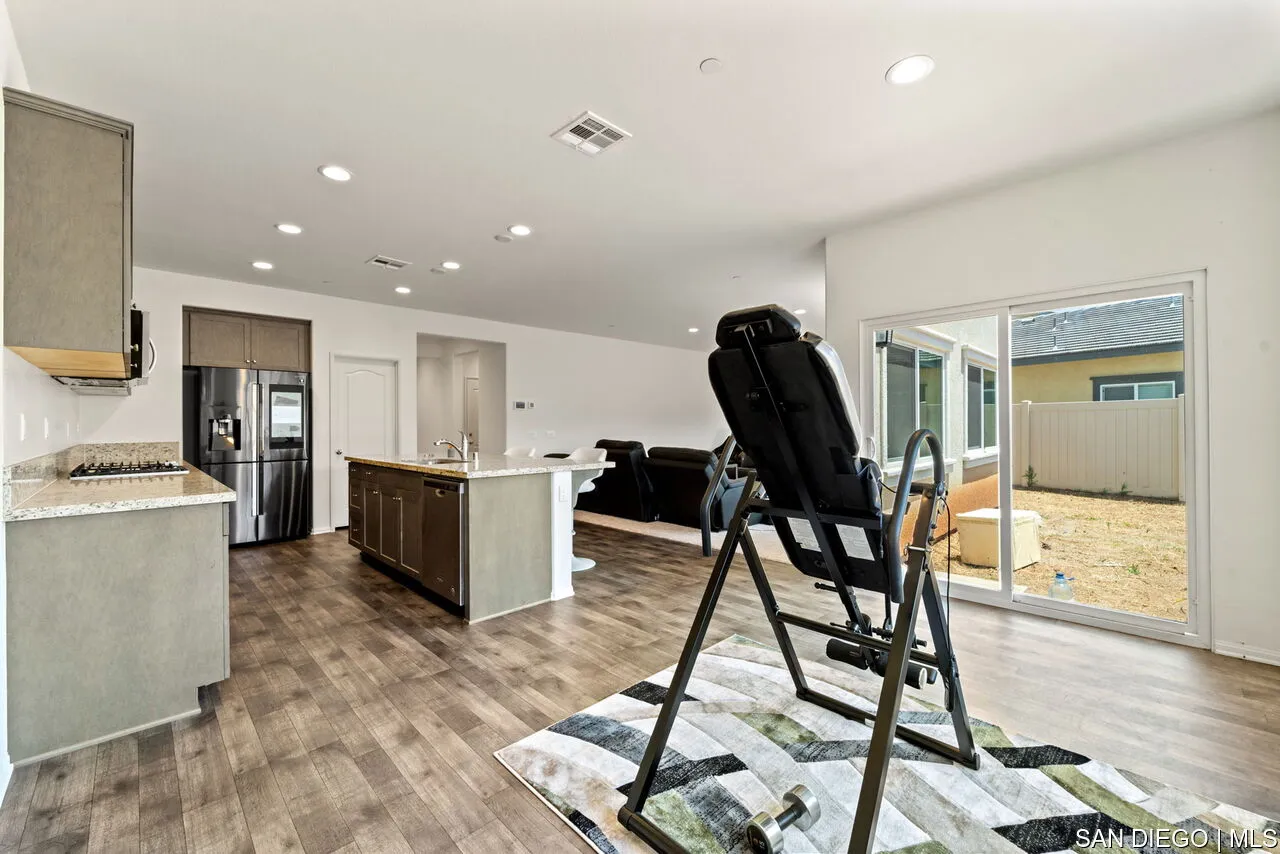 35858 Esperia Way Fallbrook, CA 92028 - Photo 6 of 37 a view of kitchen with dining table and chairs