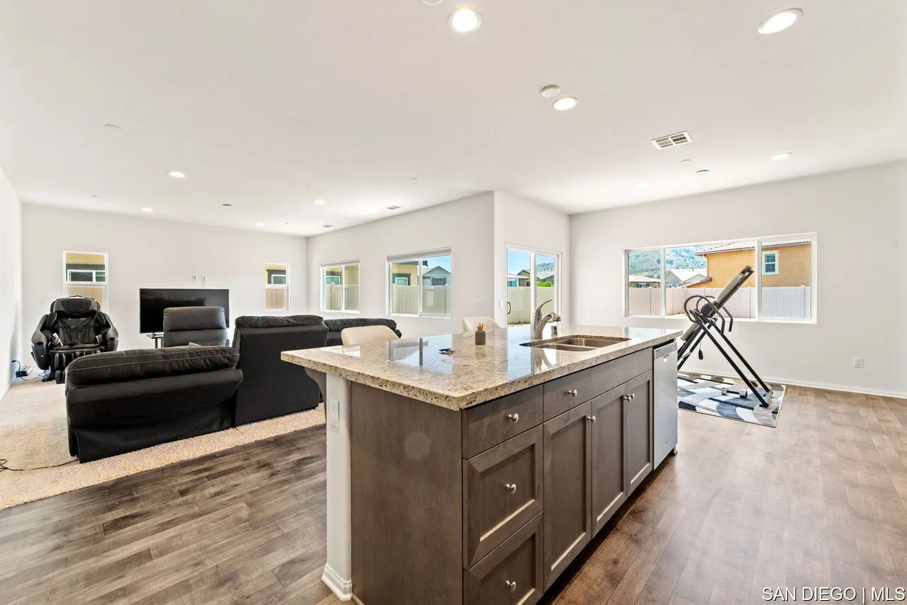 35858 Esperia Way Fallbrook, CA 92028 - Photo 10 of 37 a view of kitchen center island and living room