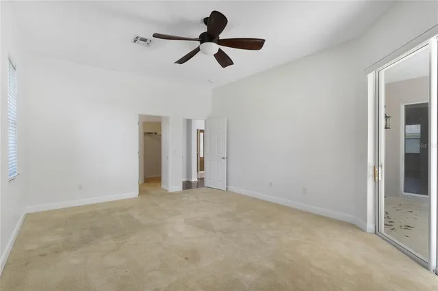 a view of room with ceiling fan