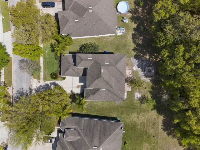 an aerial view of a house with a garden