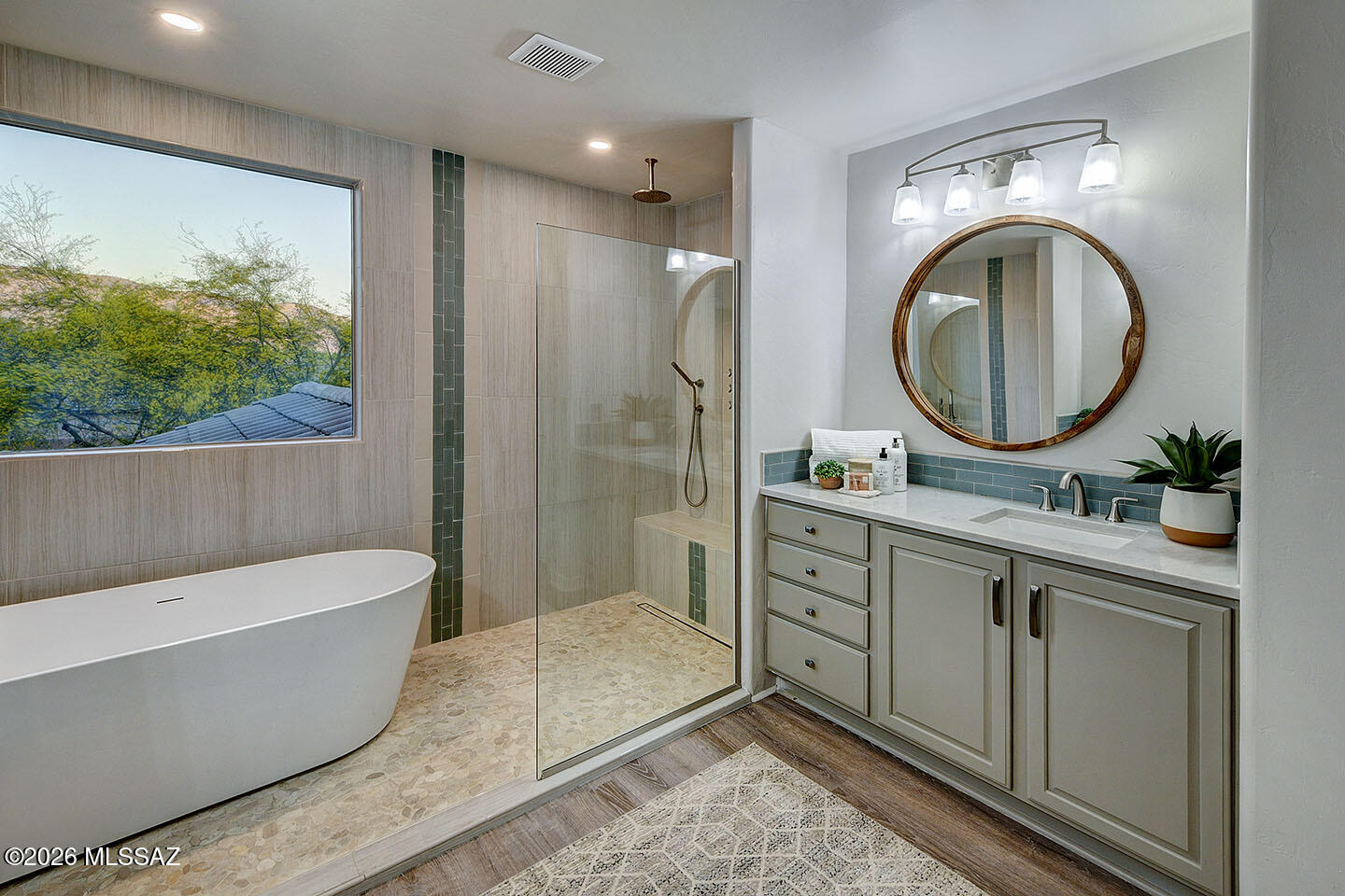 13464 North Piemonte Way Oro Valley, AZ 85755 - Photo 17 of 33 a bathroom with a tub a sink and a mirror