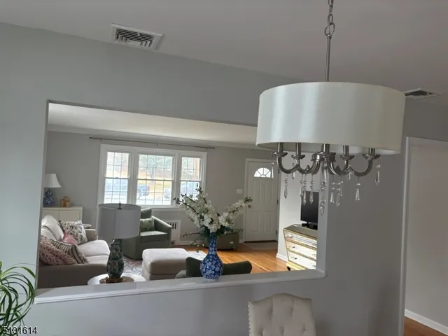 a view of living room with furniture and window