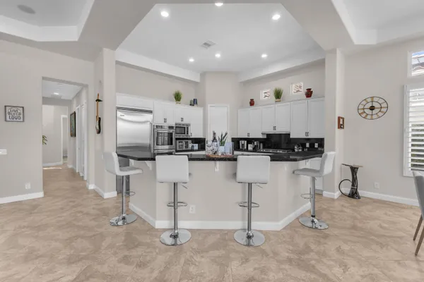 a dining room with furniture and window