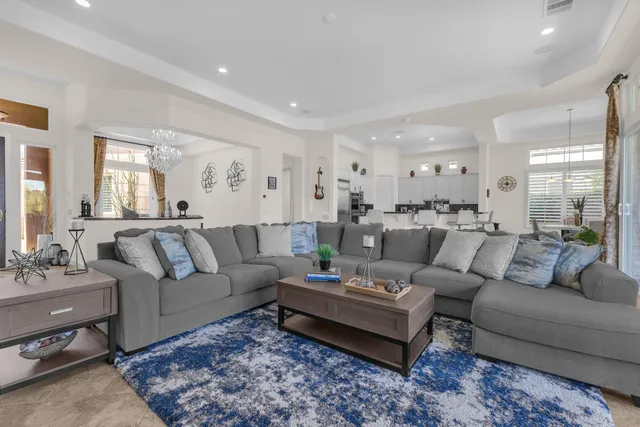 a bedroom with a bed and glass window