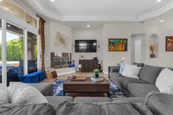 a view of a dining room with furniture and window