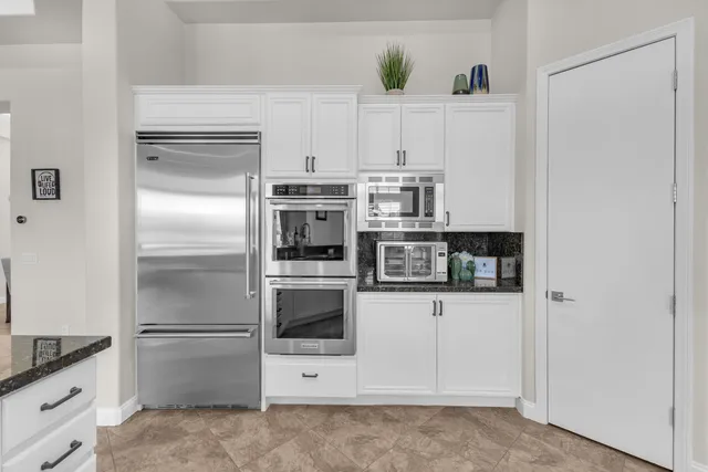 a bedroom with a bed and a television