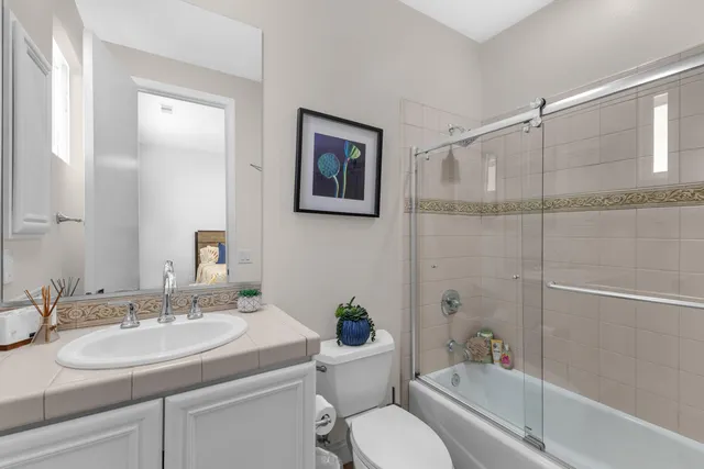 an aerial view of residential houses with outdoor space and street view