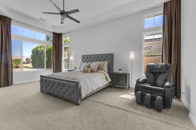 a spacious bedroom with a bed and window