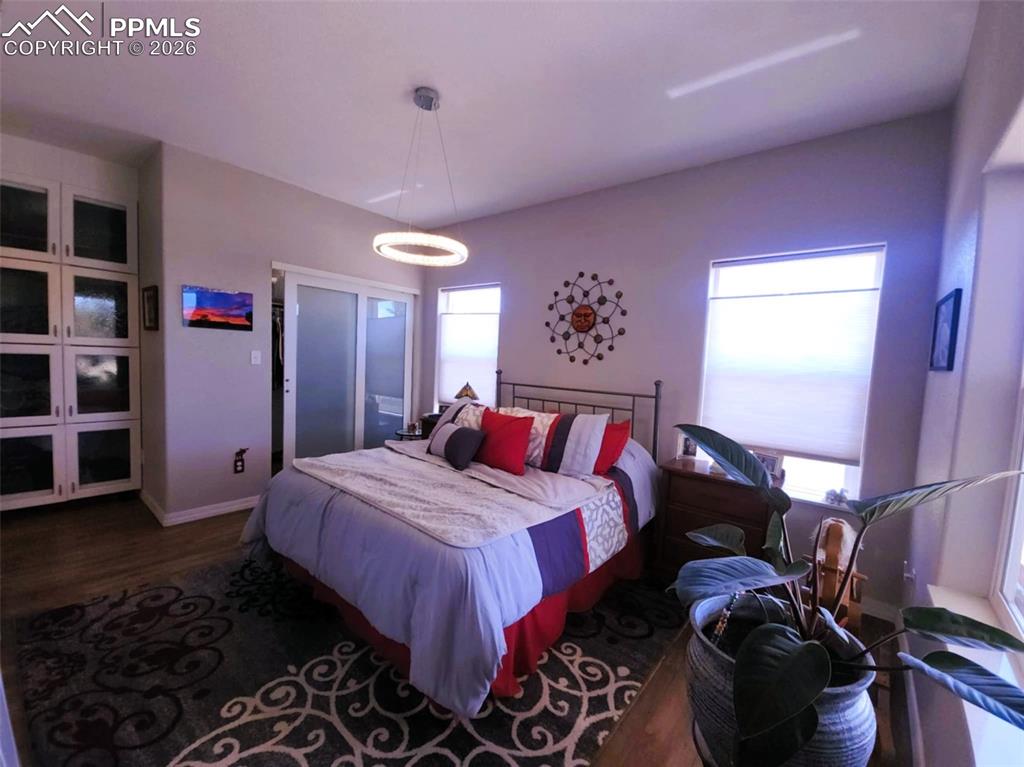 7480 Red Creek Springs Road West Pueblo, CO 81005 - Photo 14 of 47 a bedroom with a bed and a book shelf