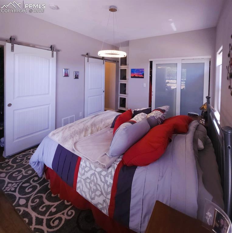7480 Red Creek Springs Road West Pueblo, CO 81005 - Photo 15 of 47 a bed room with a bed and a closet