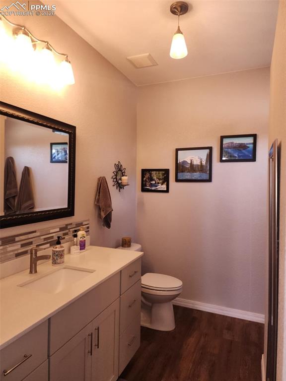 7480 Red Creek Springs Road West Pueblo, CO 81005 - Photo 18 of 47 a bathroom with a toilet sink and mirror