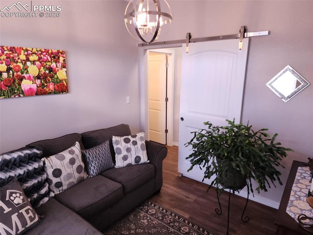 7480 Red Creek Springs Road West Pueblo, CO 81005 - Photo 22 of 47 a living room with furniture and a potted plant