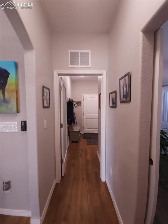 7480 Red Creek Springs Road West Pueblo, CO 81005 - Photo 25 of 47 a view of a hallway with wooden floor and closet