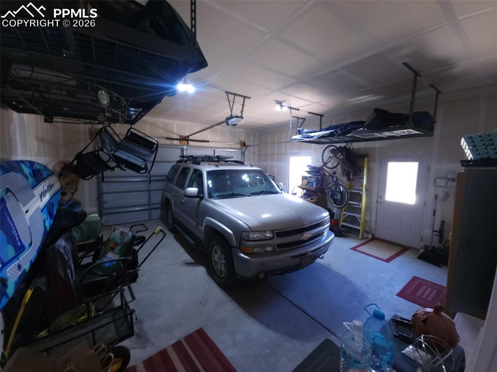 7480 Red Creek Springs Road West Pueblo, CO 81005 - Photo 28 of 47 a car parked in a garage
