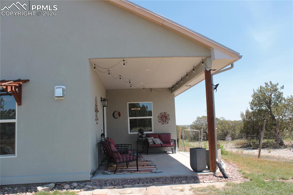 7480 Red Creek Springs Road West Pueblo, CO 81005 - Photo 30 of 47 a view of a patio with a table and chairs