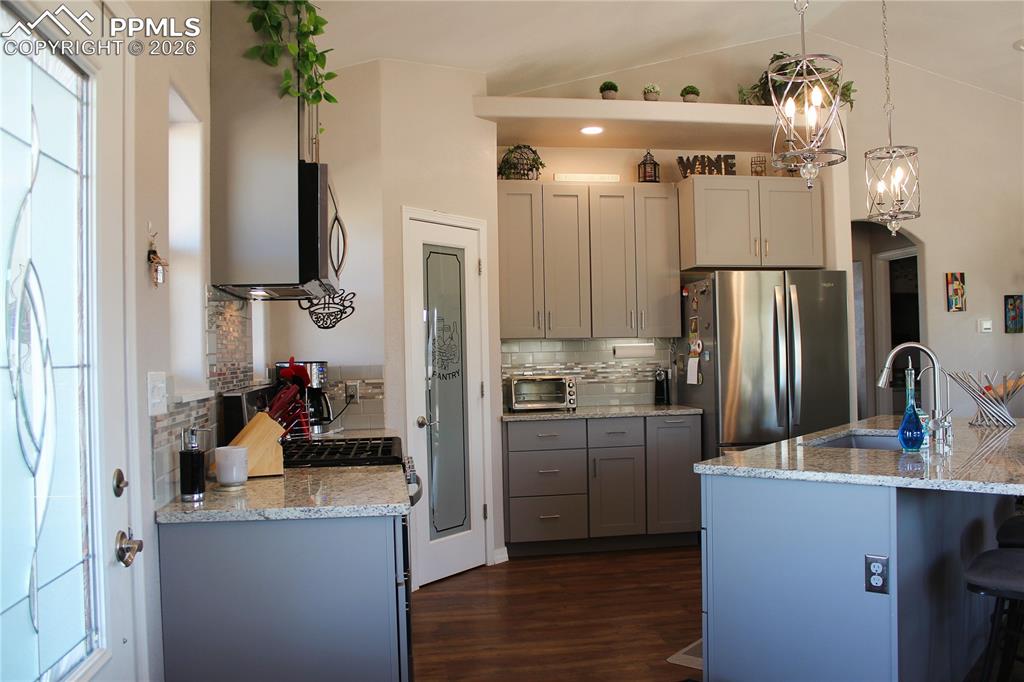 7480 Red Creek Springs Road West Pueblo, CO 81005 - Photo 5 of 47 a kitchen with cabinets and stainless steel appliances