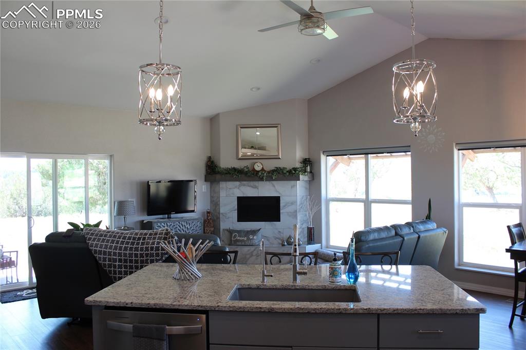 7480 Red Creek Springs Road West Pueblo, CO 81005 - Photo 10 of 47 a view of a dining room with furniture a chandelier and window