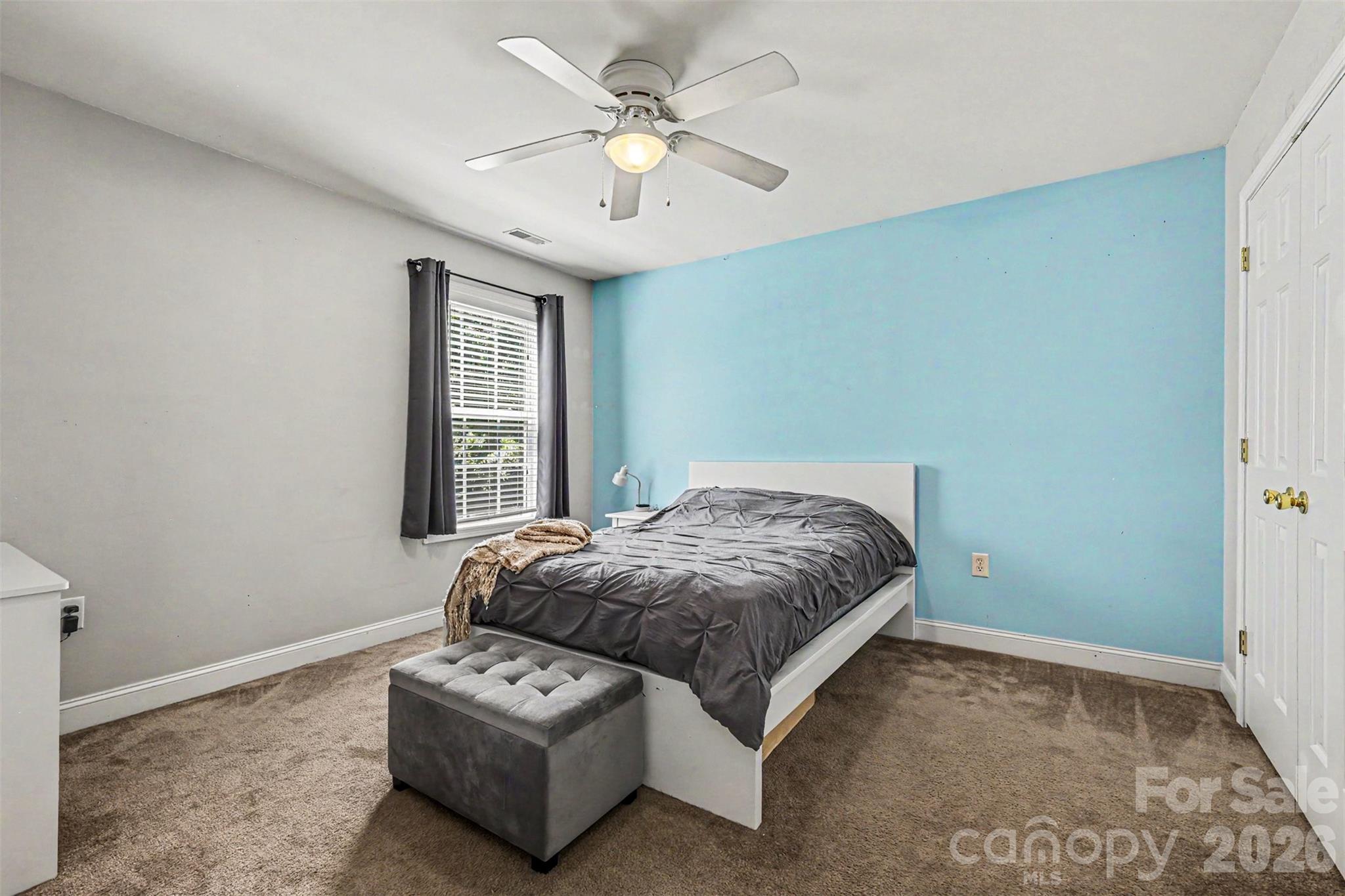 3035 Proverbs Court Monroe, NC 28110 - Photo 21 of 30 a bedroom with a bed window and couch