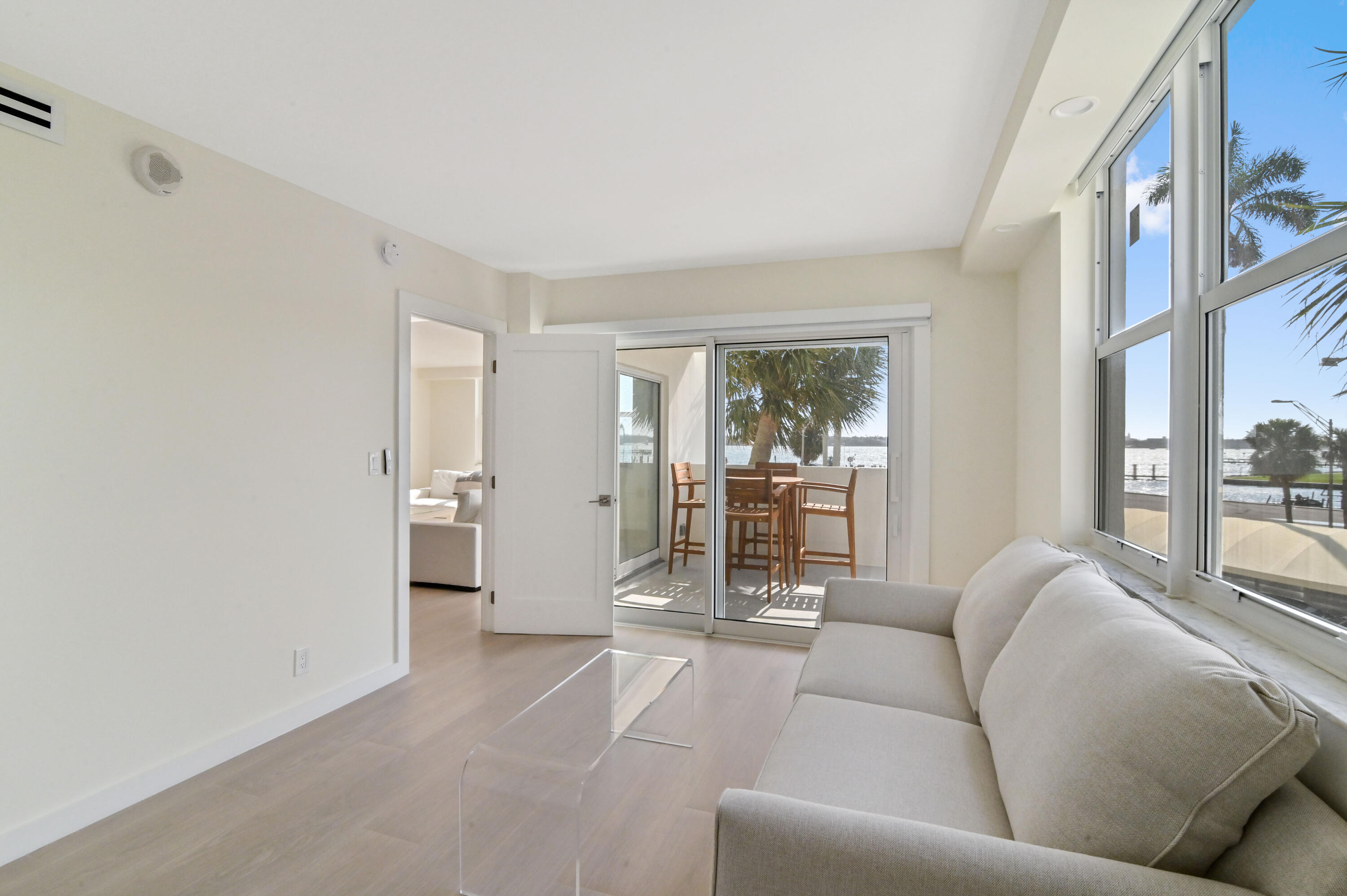 2600 North Flagler Drive, Unit 210 West Palm Beach, FL 33407 - Photo 11 of 25 a living room with furniture and large window