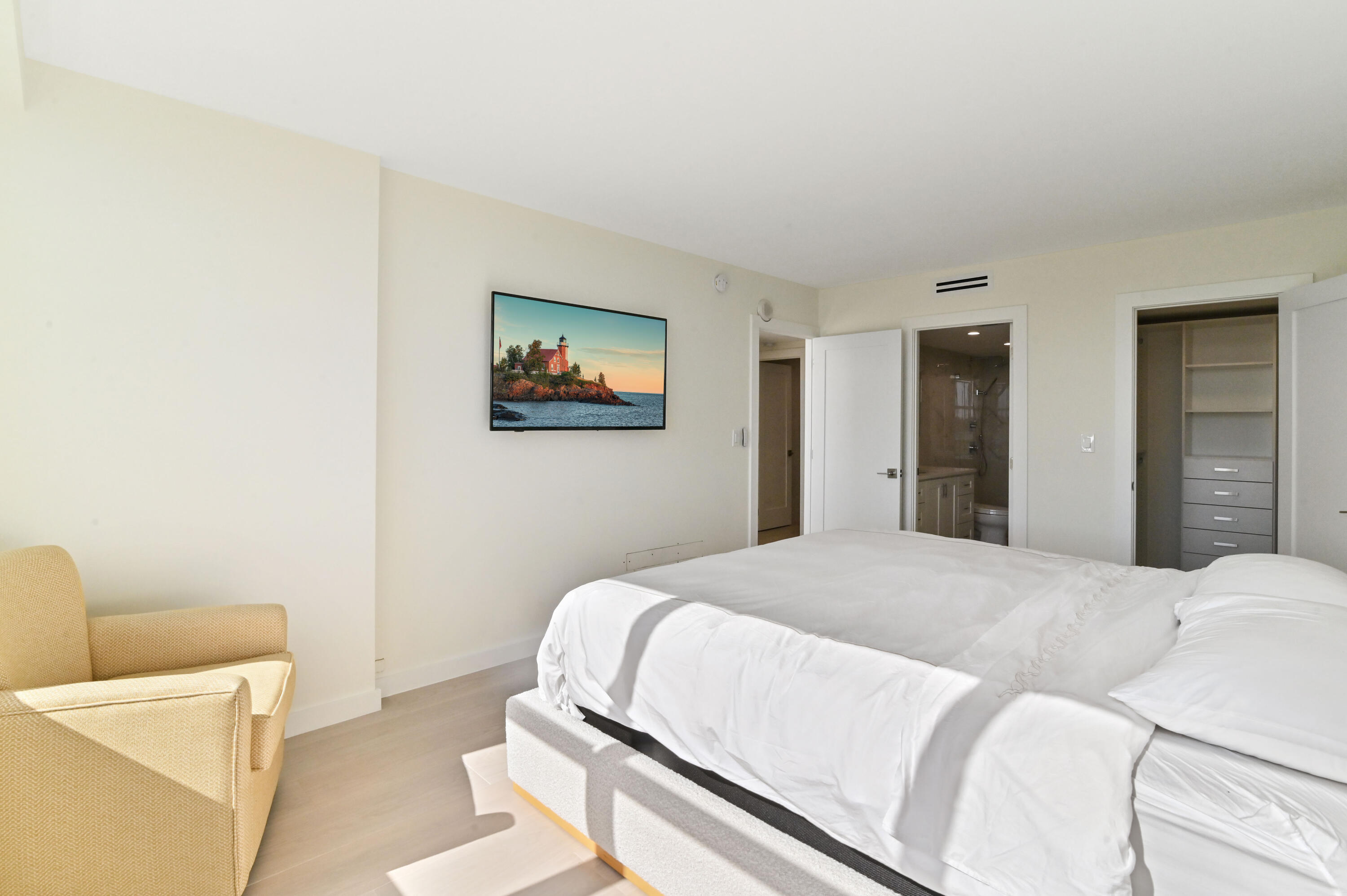 2600 North Flagler Drive, Unit 210 West Palm Beach, FL 33407 - Photo 14 of 25 a bedroom with a bed and a couch