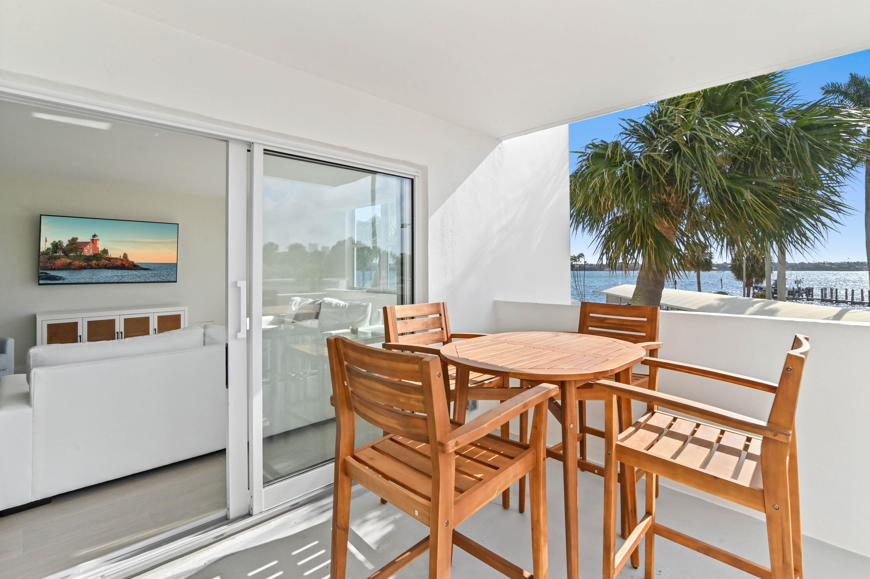 2600 North Flagler Drive, Unit 210 West Palm Beach, FL 33407 - Photo 18 of 25 a dinning table and chairs in a room