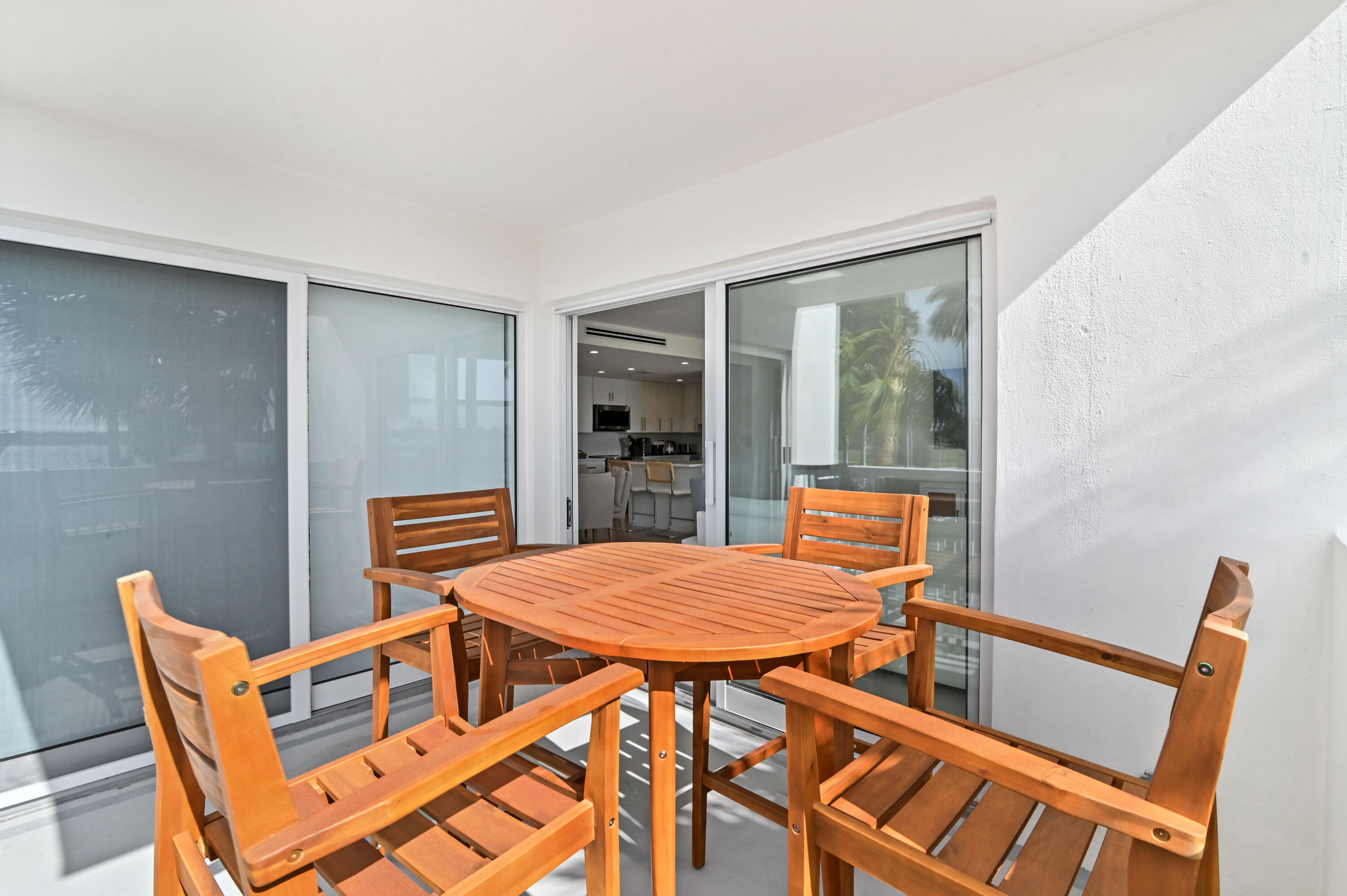 2600 North Flagler Drive, Unit 210 West Palm Beach, FL 33407 - Photo 19 of 25 a view of house with wooden deck and furniture