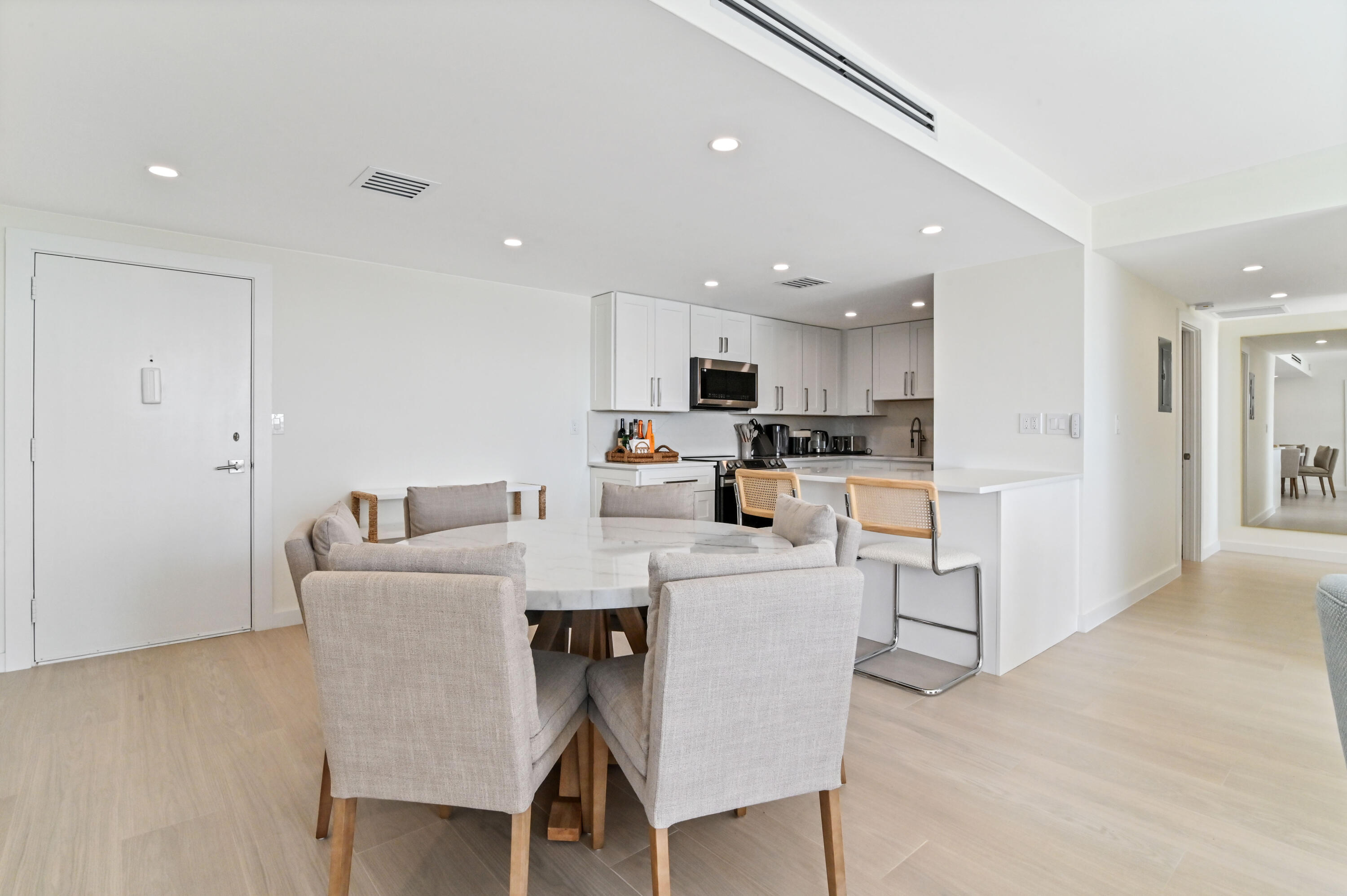 2600 North Flagler Drive, Unit 210 West Palm Beach, FL 33407 - Photo 4 of 25 a living room with stainless steel appliances furniture a dining table and kitchen view