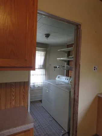 a large kitchen with a large window