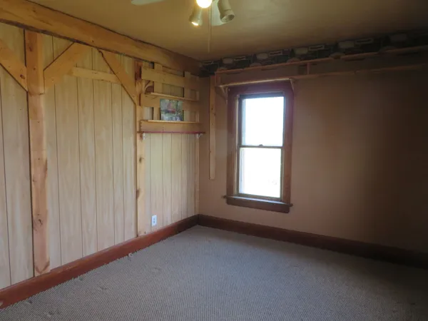 a view of a room with furniture and a chandelier
