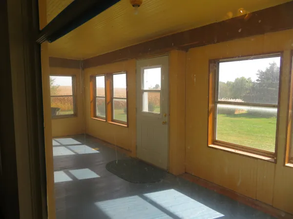 a view of hallway with windows