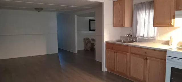 a kitchen with a sink and a window