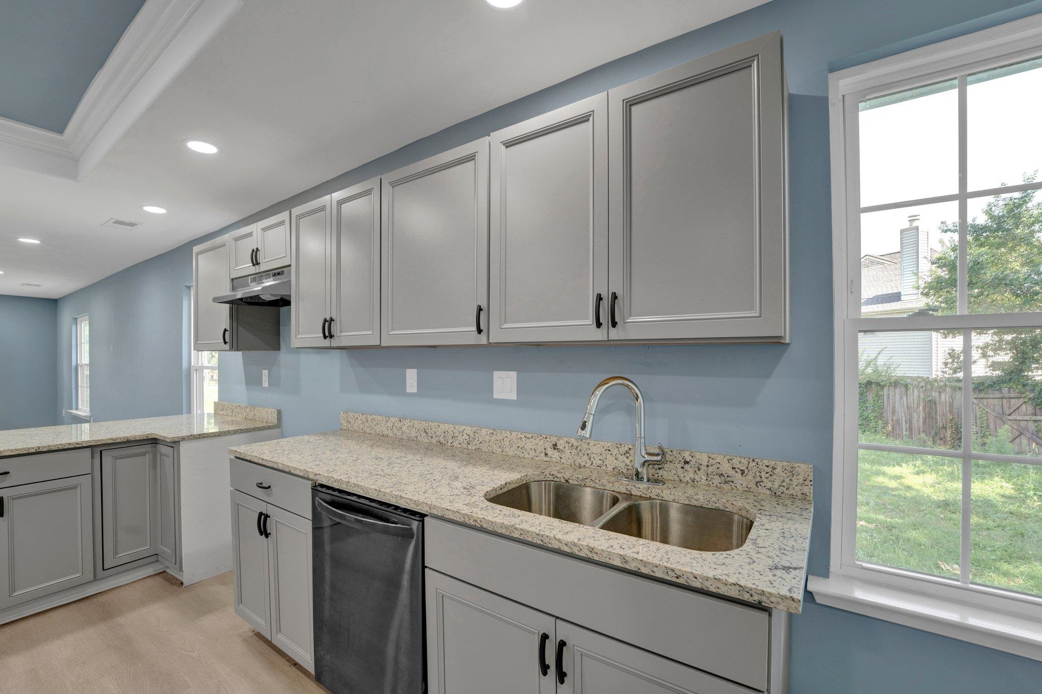7030 Raleigh Lagrange Road Cordova, TN 38018 - Photo 11 of 27 a kitchen with white cabinets and a sink