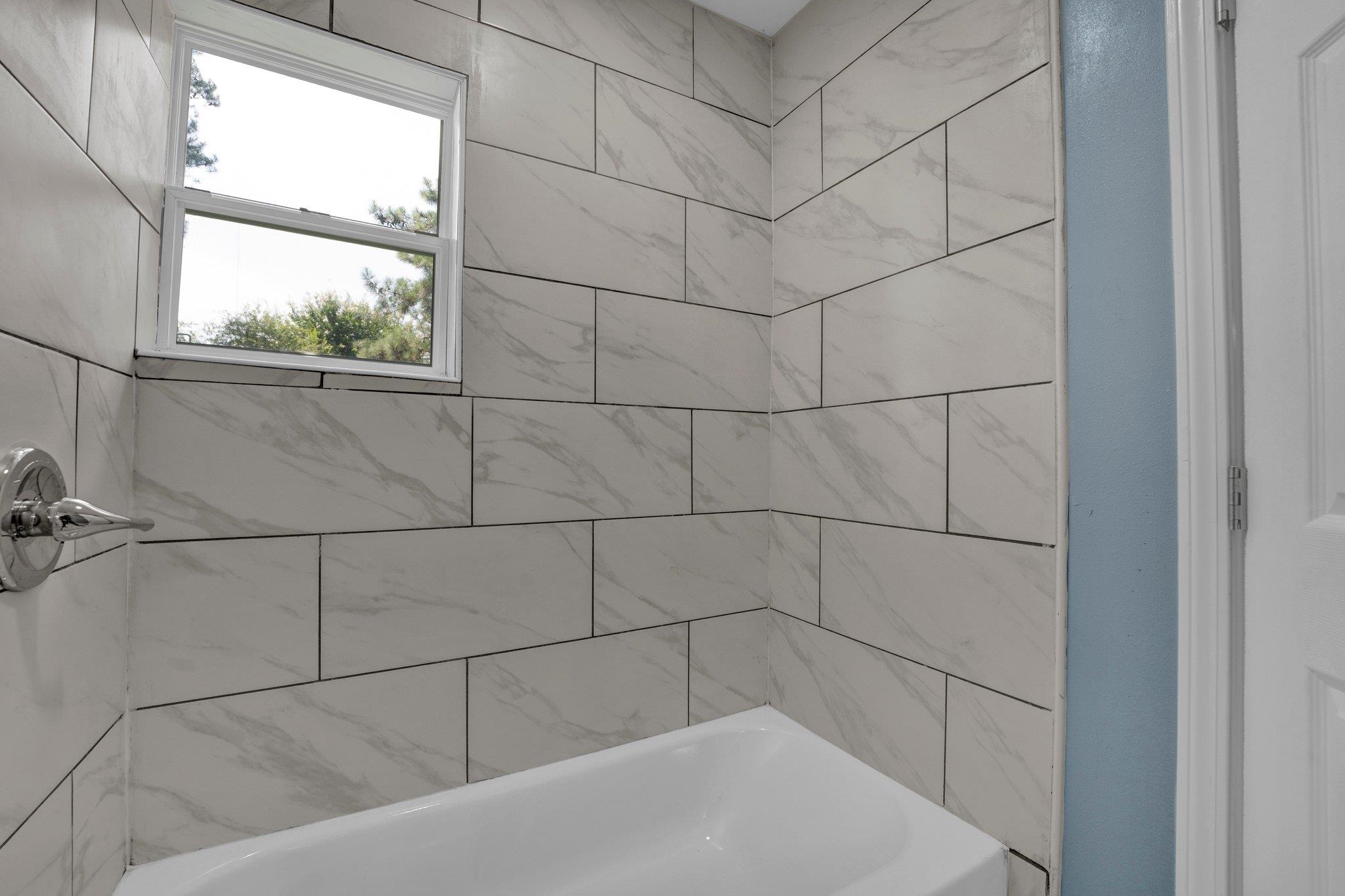 7030 Raleigh Lagrange Road Cordova, TN 38018 - Photo 18 of 27 a bathroom with a bathtub