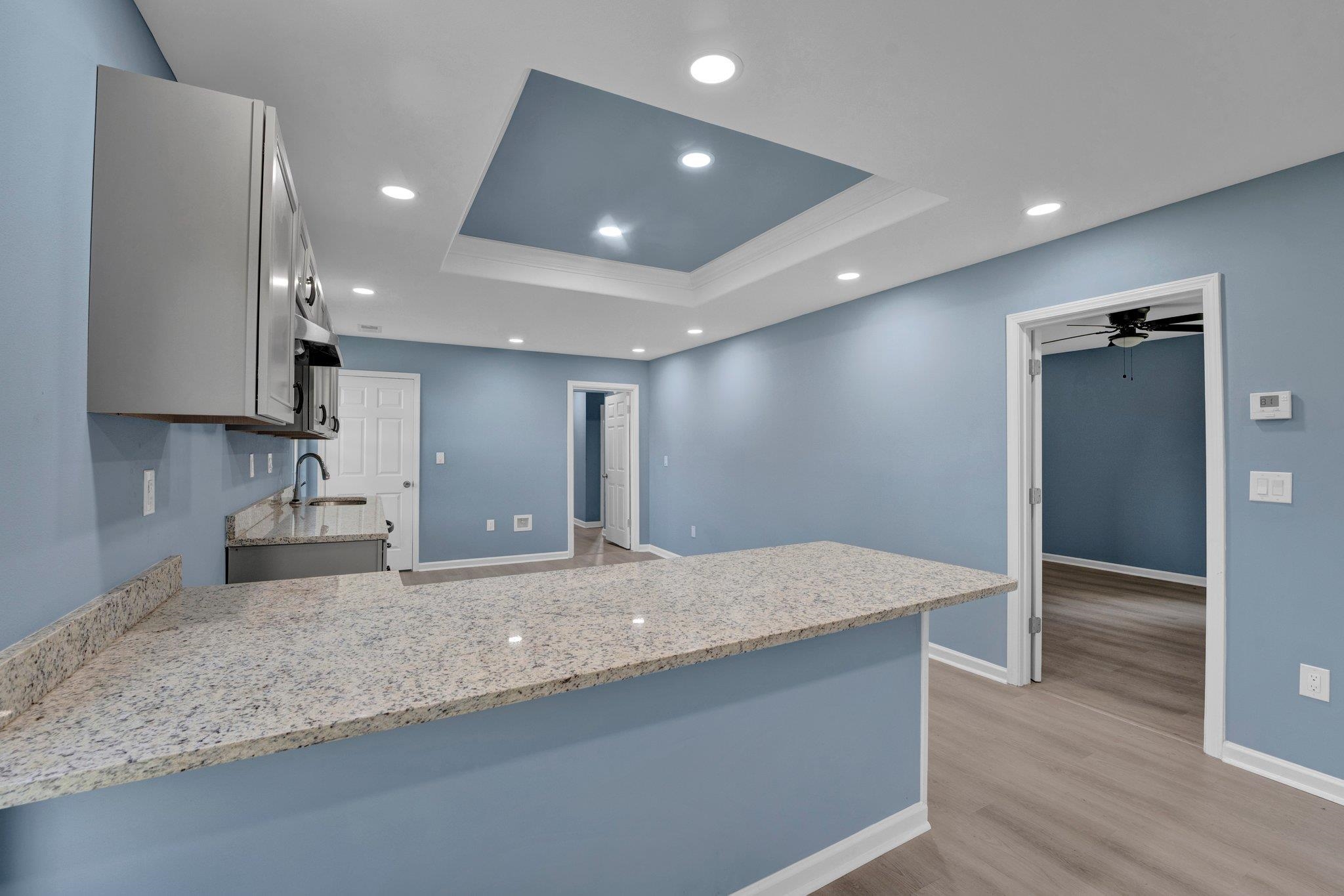 7030 Raleigh Lagrange Road Cordova, TN 38018 - Photo 8 of 27 a kitchen with kitchen island a sink and a refrigerator