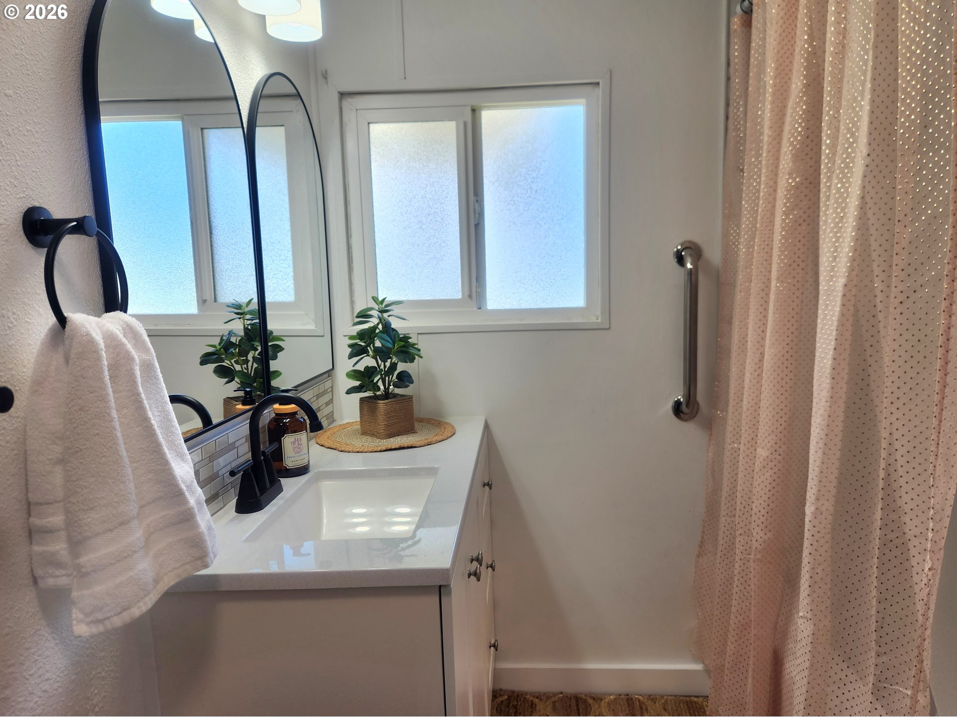 507 North 19th Avenue, Unit 29 Cornelius, OR 97113 - Photo 16 of 26 a bathroom with a sink a mirror and a window