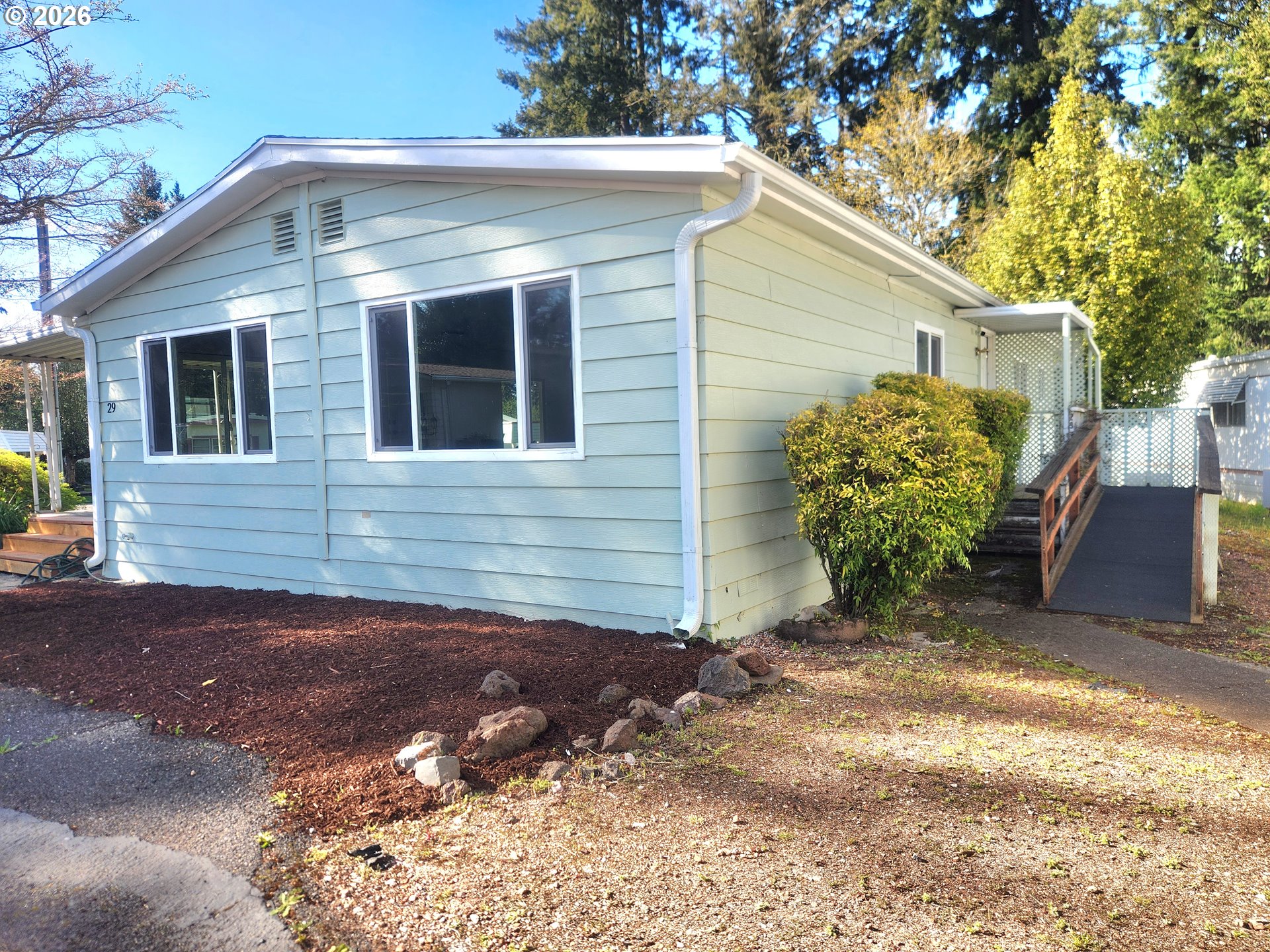 507 North 19th Avenue, Unit 29 Cornelius, OR 97113 - Photo 2 of 26 a front view of a house with garden
