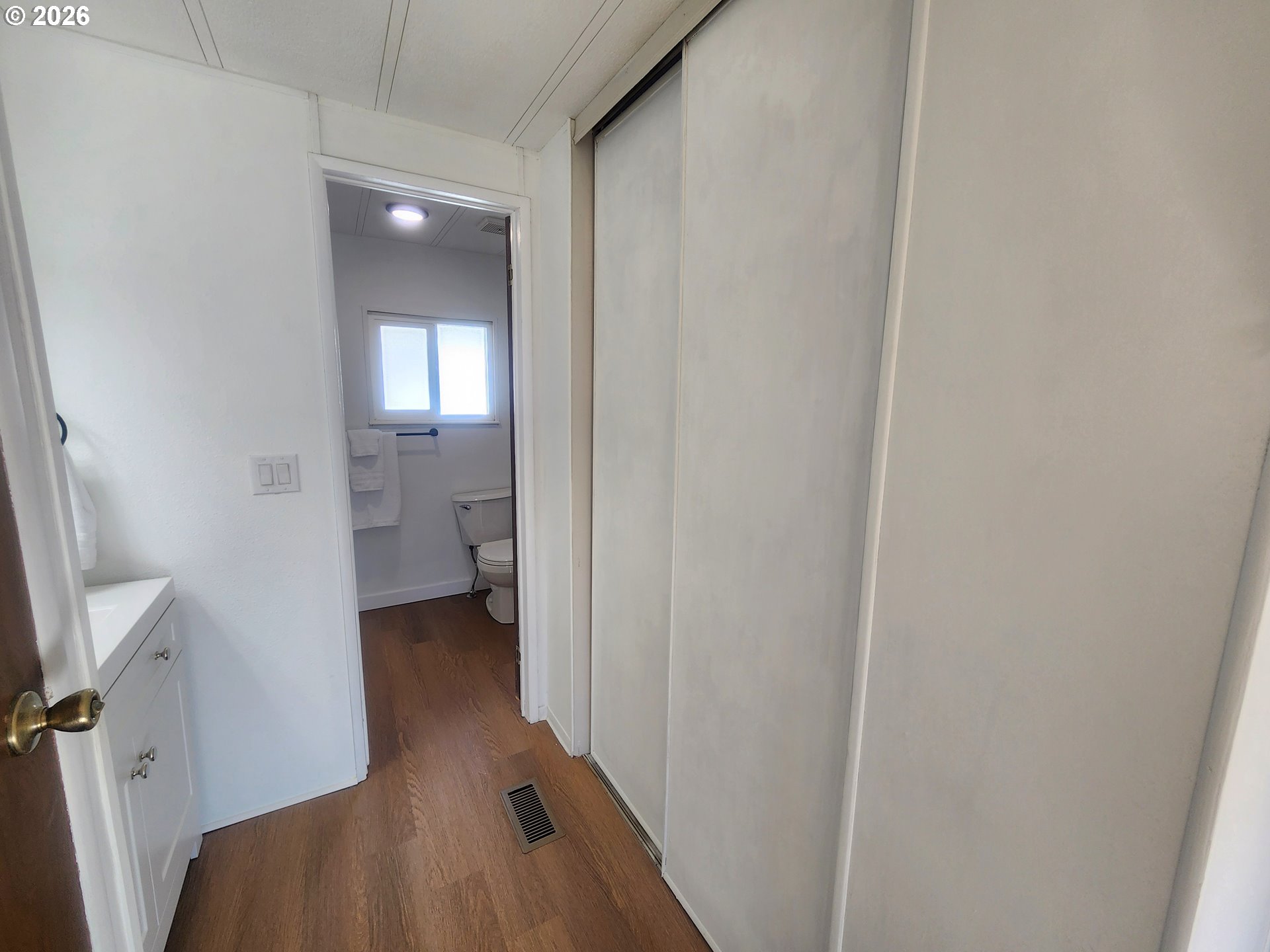 507 North 19th Avenue, Unit 29 Cornelius, OR 97113 - Photo 21 of 26 a view of a room with wooden floor and a bathroom