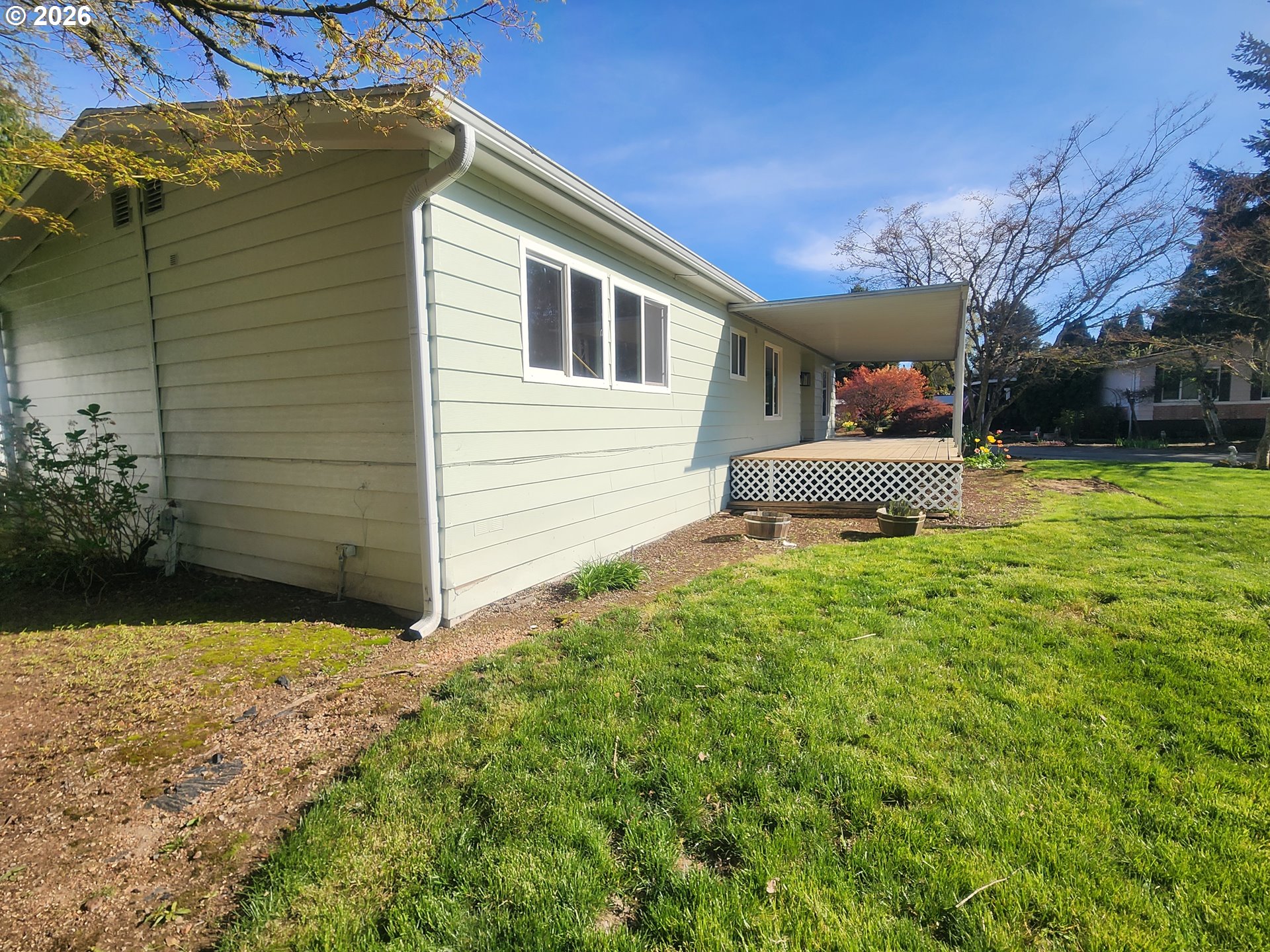 507 North 19th Avenue, Unit 29 Cornelius, OR 97113 - Photo 25 of 26 a backyard of a house with table and chairs