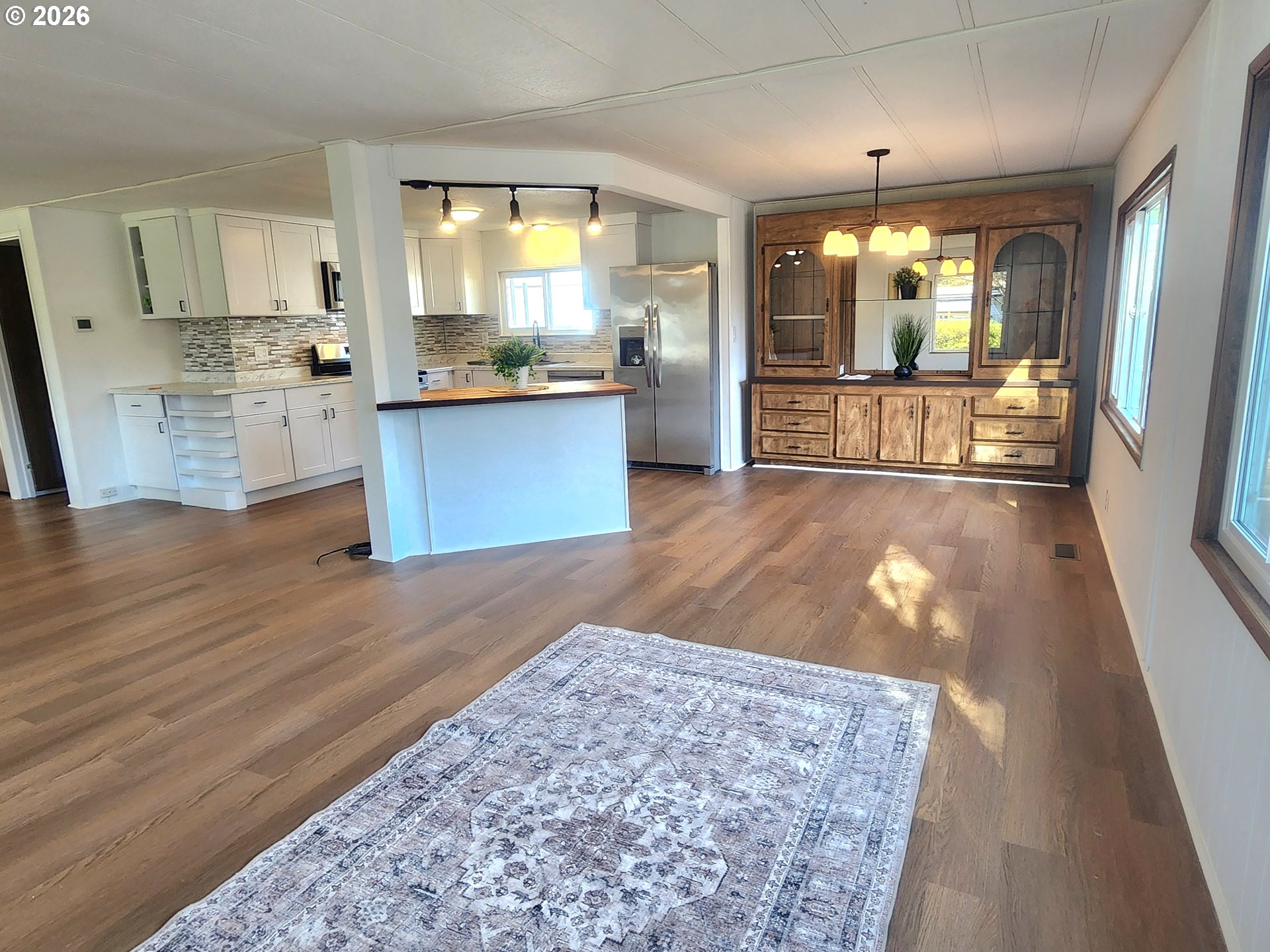 507 North 19th Avenue, Unit 29 Cornelius, OR 97113 - Photo 8 of 26 a large kitchen with cabinets and wooden floor