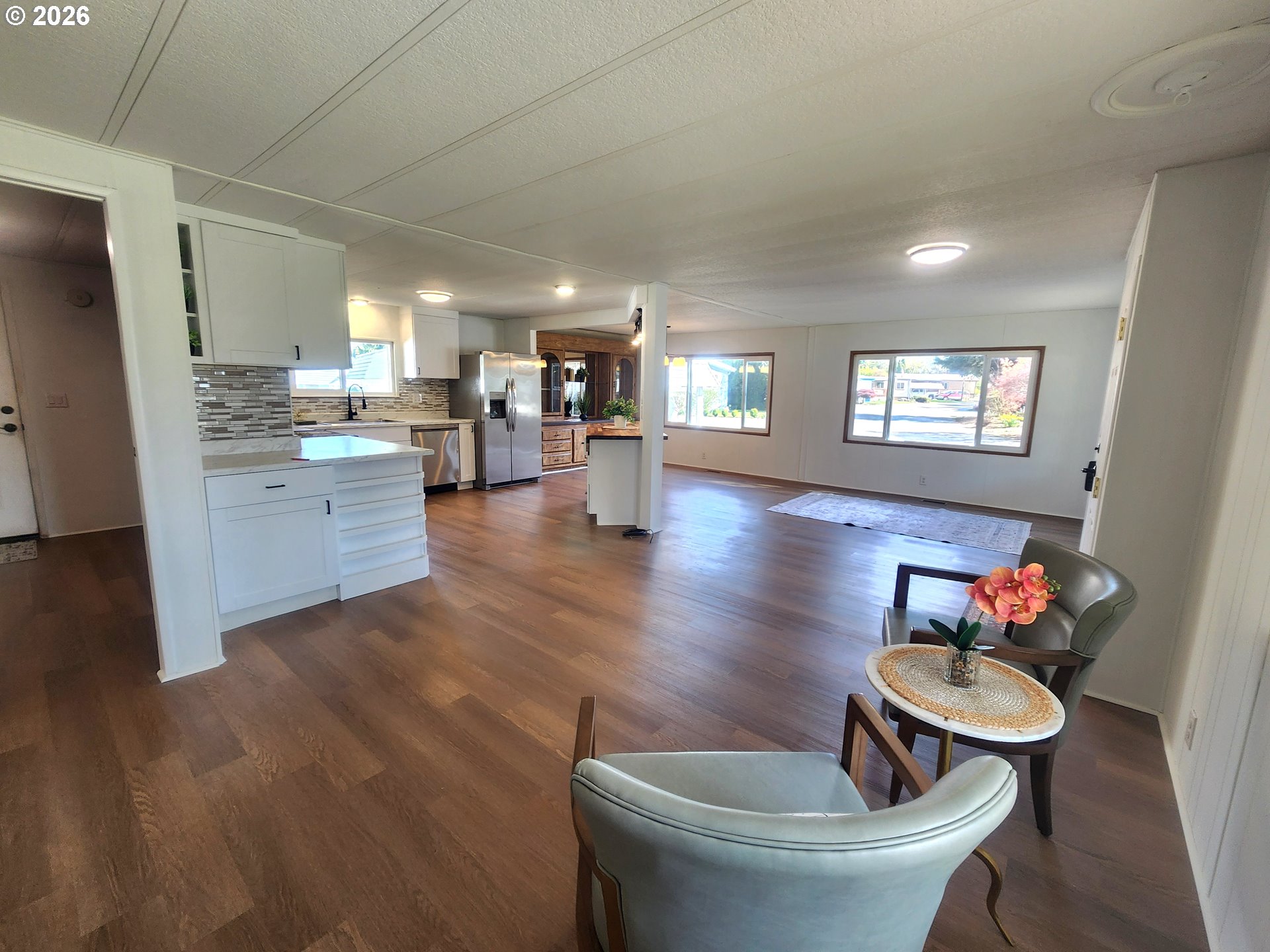 507 North 19th Avenue, Unit 29 Cornelius, OR 97113 - Photo 10 of 26 a kitchen with a wooden floor dining table and chairs