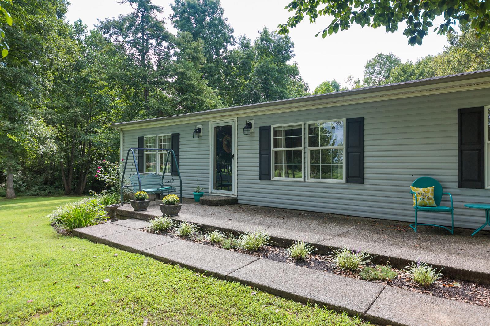 6345 Roy Pearson Road Springfield, TN 37172 - Photo 1 of 30 a front view of a house with garden