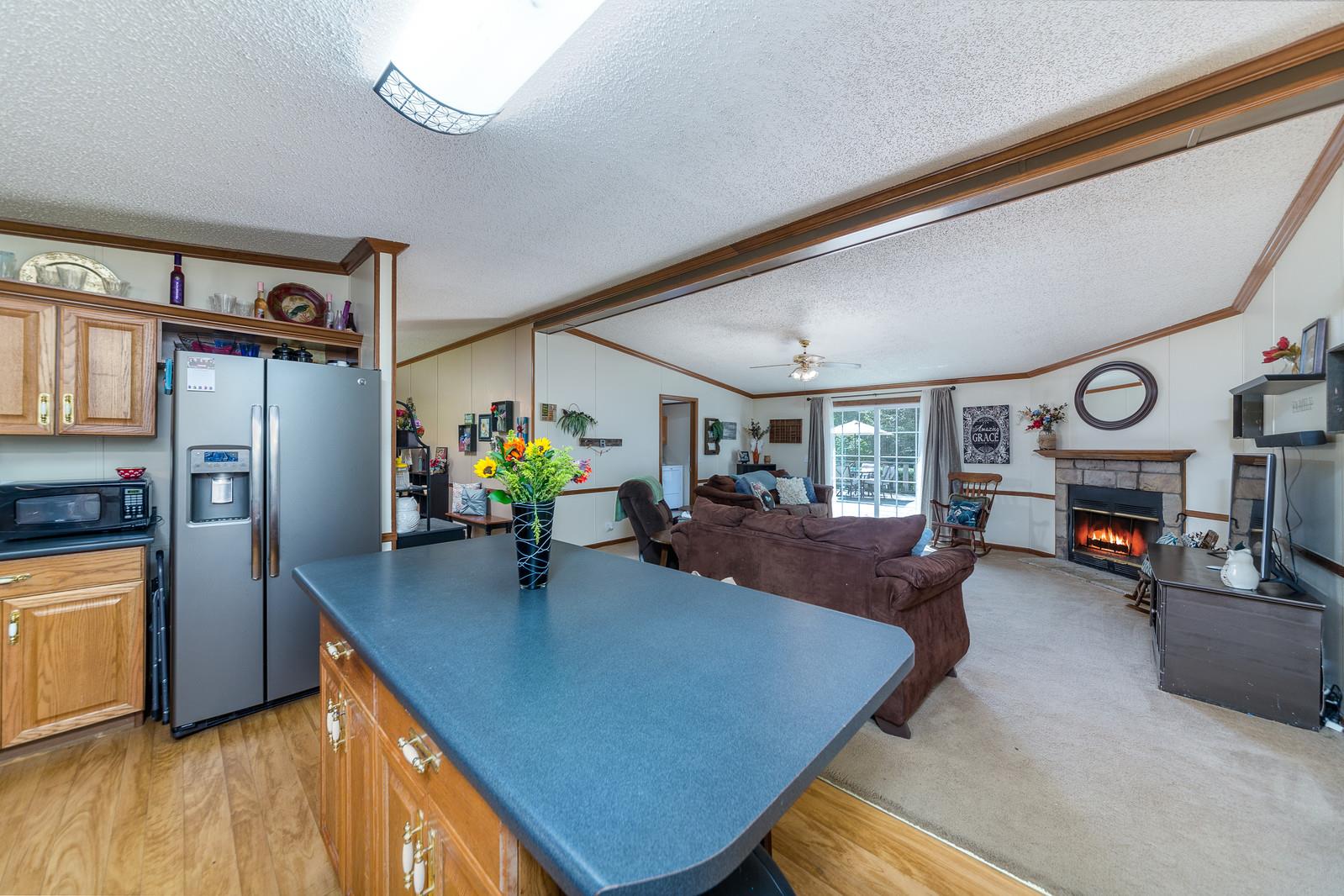 6345 Roy Pearson Road Springfield, TN 37172 - Photo 11 of 30 a living room with furniture and a flat screen tv