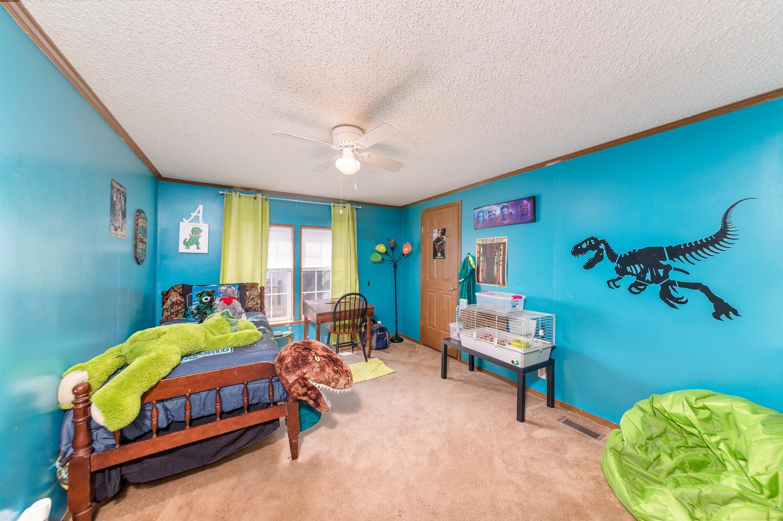 6345 Roy Pearson Road Springfield, TN 37172 - Photo 19 of 30 a bedroom with a bed and a chair