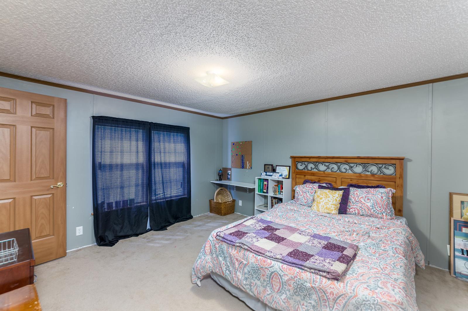 6345 Roy Pearson Road Springfield, TN 37172 - Photo 22 of 30 a bedroom with a large bed and a closet