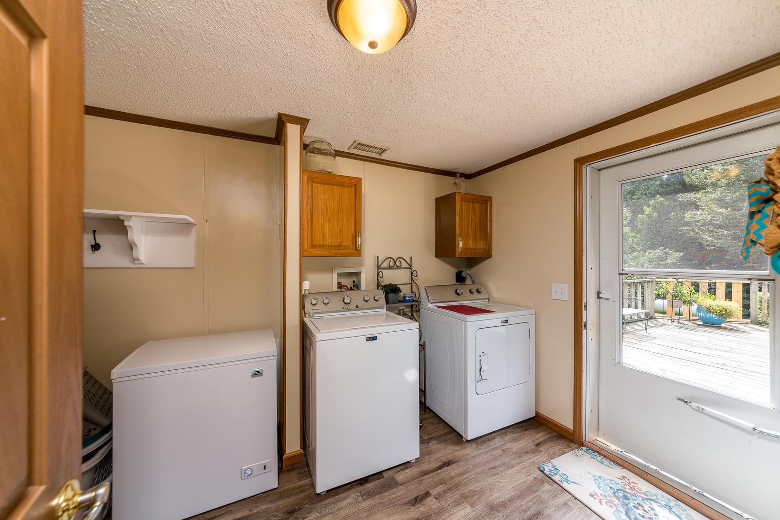 6345 Roy Pearson Road Springfield, TN 37172 - Photo 23 of 30 a view of storage and utility room with washer and dryer