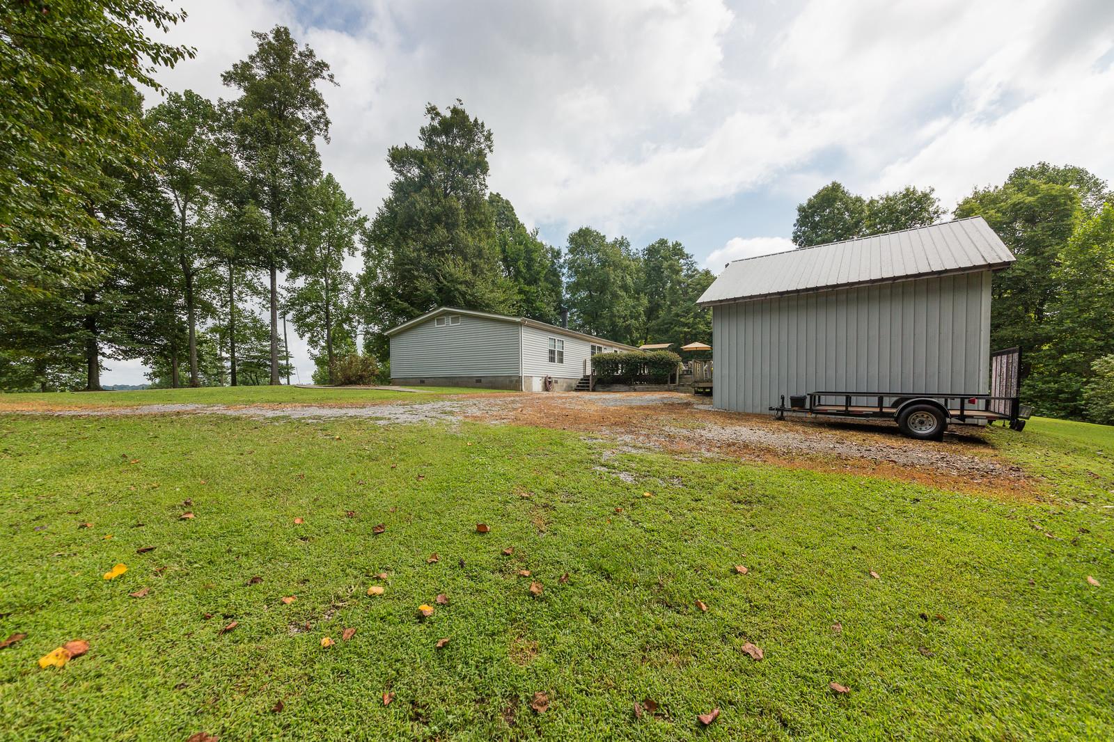 6345 Roy Pearson Road Springfield, TN 37172 - Photo 27 of 30 a swimming pool with outdoor seating and yard
