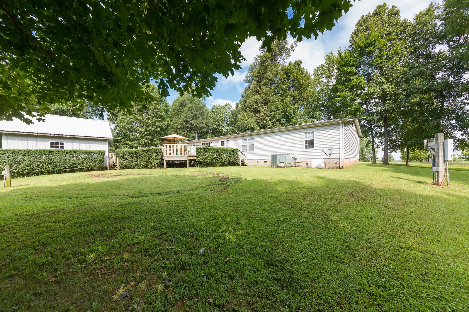 6345 Roy Pearson Road Springfield, TN 37172 - Photo 28 of 30 a view of a house with backyard and garden