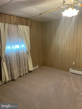 a view of a closet with wooden floor